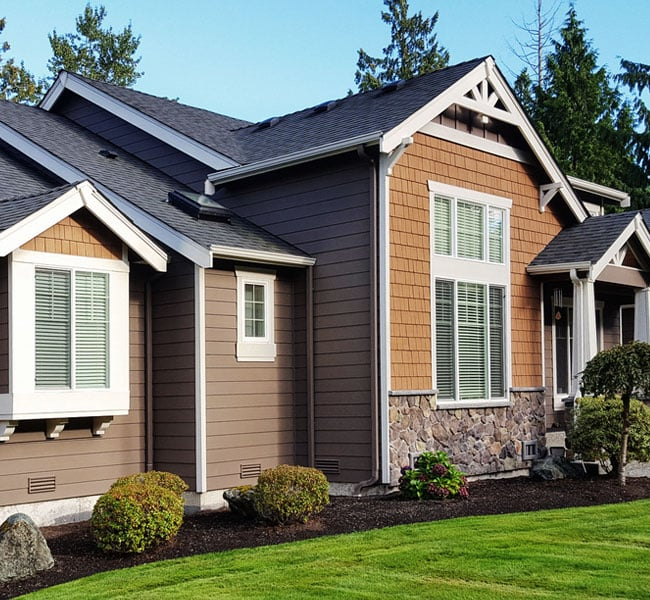 Home with siding and roofing