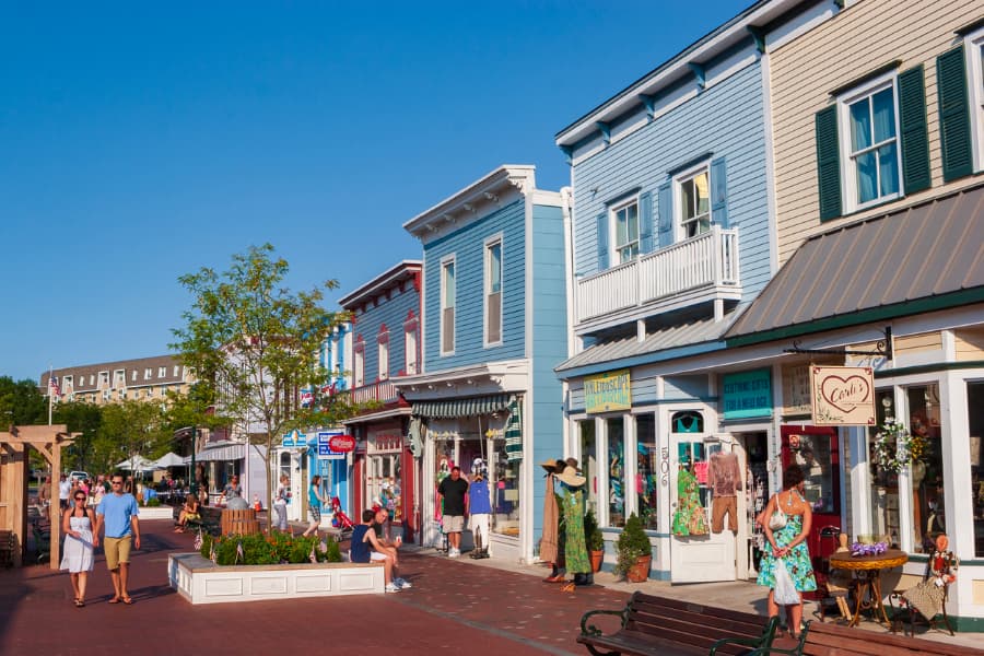 Street view of colorful storefronts with vinyl siding