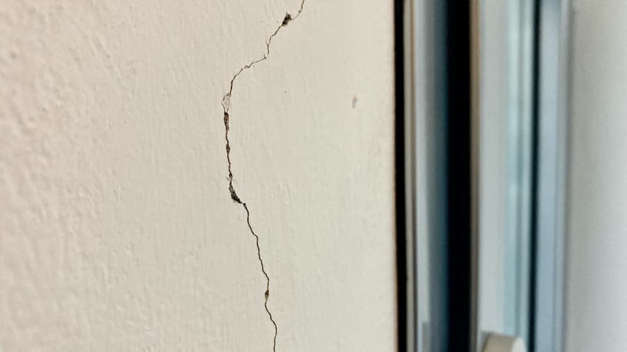 Close-up of crack in stucco siding